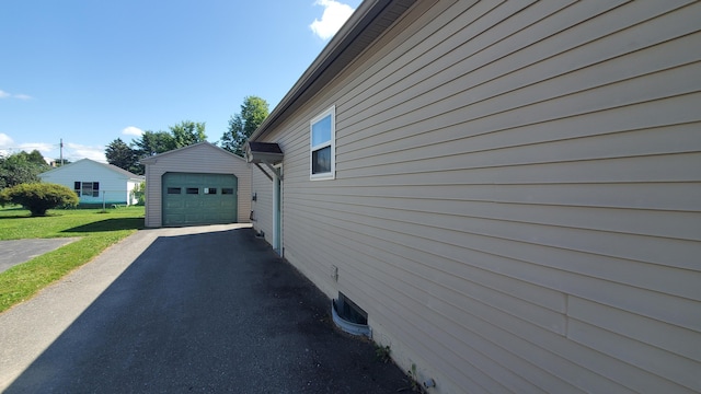 9 Wood St, Bangor, ME 04401 - view of property exterior with driveway, a garage, an outdoor structure, and a yard