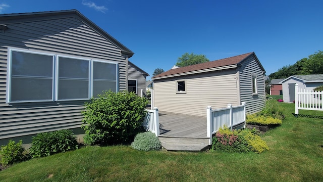 9 Wood St, Bangor, ME 04401 - view of side of property featuring a wooden deck and a lawn