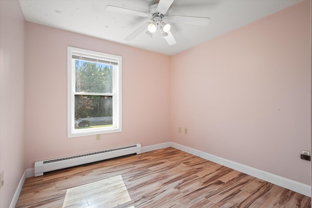 2 Bryer Heights Rd, Milford, ME 04461 - spare room with a baseboard heating unit, light wood finished floors, and a ceiling fan