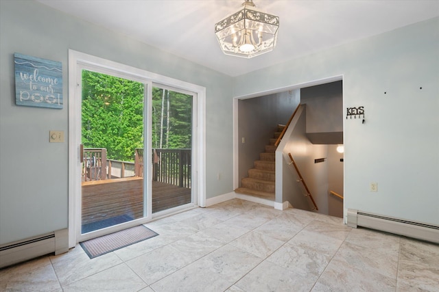 2 Bryer Heights Rd, Milford, ME 04461 - doorway featuring a baseboard heating unit, a chandelier, and stairs