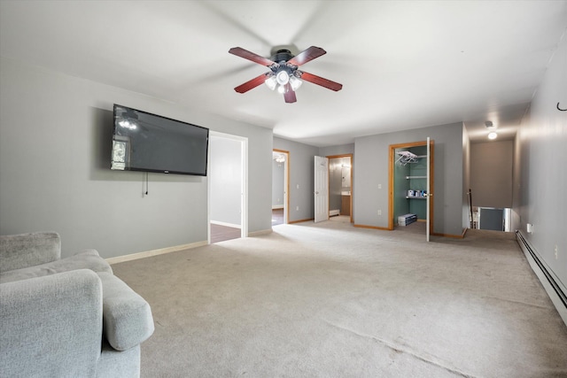 2 Bryer Heights Rd, Milford, ME 04461 - unfurnished living room with baseboard heating, a ceiling fan, and light carpet