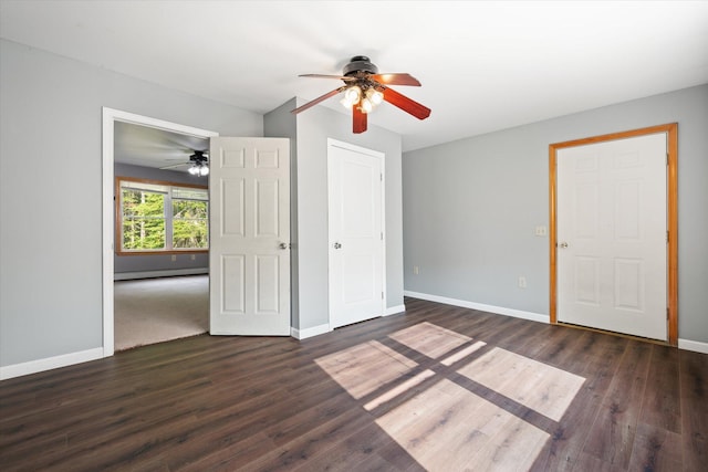 2 Bryer Heights Rd, Milford, ME 04461 - unfurnished bedroom featuring wood finished floors, a baseboard radiator, and a ceiling fan