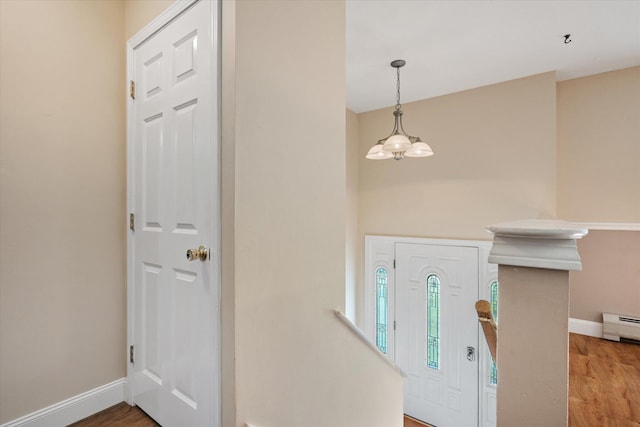 2 Bryer Heights Rd, Milford, ME 04461 - entryway featuring light wood finished floors, a chandelier, and baseboard heating