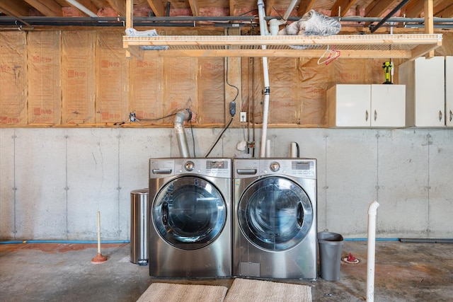 2 Bryer Heights Rd, Milford, ME 04461 - laundry room featuring separate washer and dryer and cabinet space