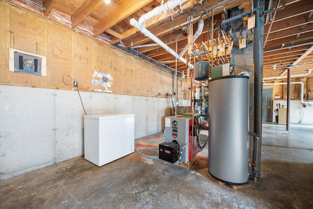 2 Bryer Heights Rd, Milford, ME 04461 - unfinished below grade area with water heater, refrigerator, and a heating unit