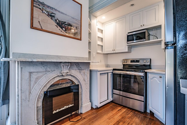 12 Deering St Unit 1, Portland, ME 04101 - kitchen with appliances with stainless steel finishes, open shelves, and light countertops