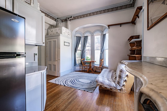 12 Deering St Unit 1, Portland, ME 04101 - sitting room with hardwood / wood-style floors and arched walkways