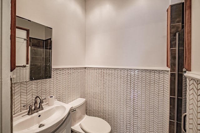 12 Deering St Unit 1, Portland, ME 04101 - bathroom with a wainscoted wall, tile walls, and vanity