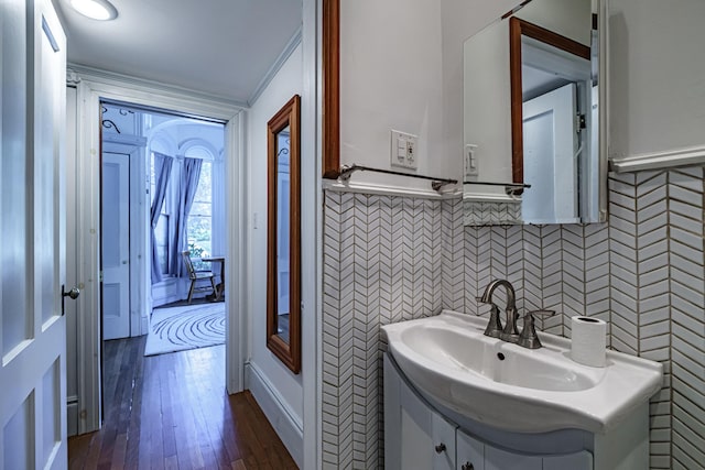 12 Deering St Unit 1, Portland, ME 04101 - bathroom featuring vanity, wood finished floors, wainscoting, and tile walls