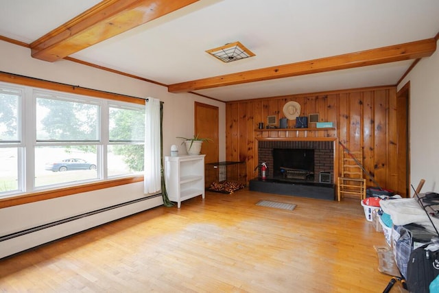 103 Mountain View Rd, Farmington, ME 04938 - living room featuring a baseboard heating unit, beamed ceiling, light wood-style floors, a brick fireplace, and wooden walls