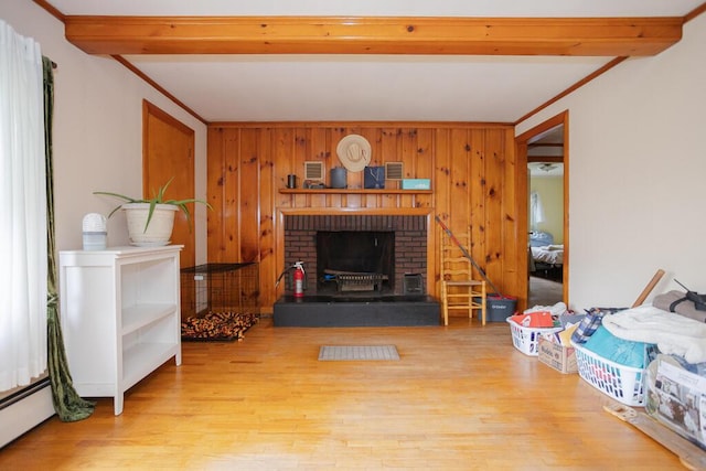 103 Mountain View Rd, Farmington, ME 04938 - unfurnished living room featuring beamed ceiling, wood finished floors, wood walls, and a baseboard heating unit
