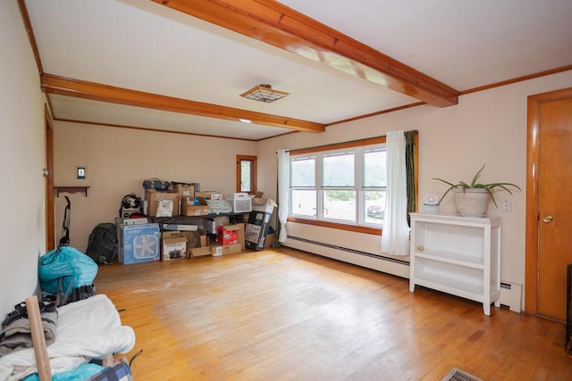 103 Mountain View Rd, Farmington, ME 04938 - misc room with a baseboard heating unit, beam ceiling, and wood finished floors