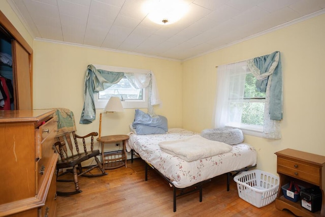 103 Mountain View Rd, Farmington, ME 04938 - bedroom with crown molding and wood finished floors
