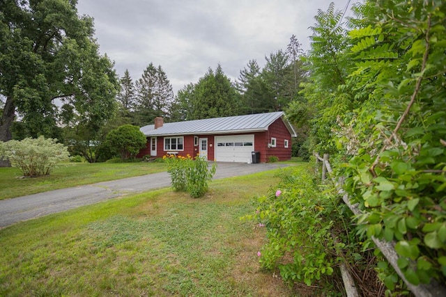 103 Mountain View Rd, Farmington, ME 04938 - ranch-style home with a chimney, driveway, a standing seam roof, an attached garage, and a front lawn