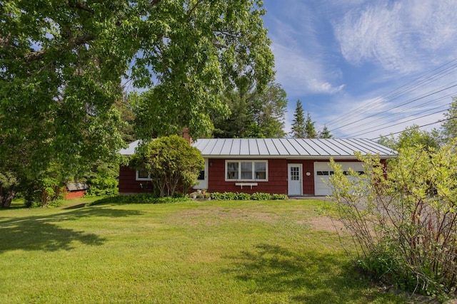 103 Mountain View Rd, Farmington, ME 04938 - single story home with a standing seam roof, a garage, a front yard, a chimney, and a metal roof