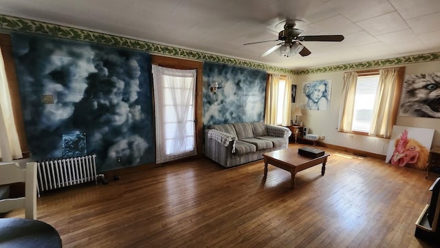 28 Eastland Ave, Millinocket, ME 04462 - living room with radiator heating unit, wood-type flooring, and a ceiling fan