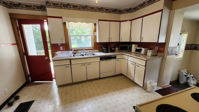 28 Eastland Ave, Millinocket, ME 04462 - kitchen with dishwasher, light countertops, and light flooring