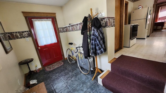 28 Eastland Ave, Millinocket, ME 04462 - foyer featuring tile patterned floors and baseboards