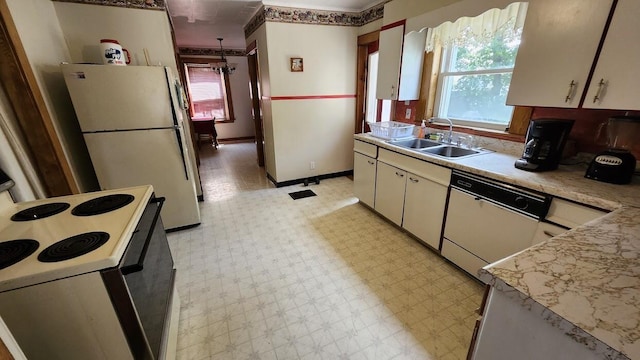 28 Eastland Ave, Millinocket, ME 04462 - kitchen featuring white appliances, light flooring, light countertops, and white cabinetry