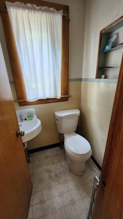 28 Eastland Ave, Millinocket, ME 04462 - bathroom with tile patterned floors and toilet
