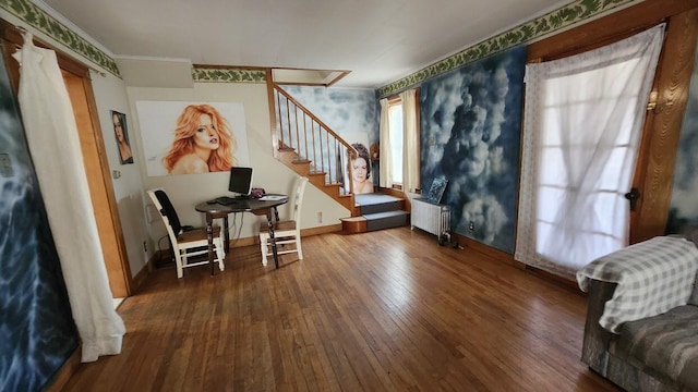 28 Eastland Ave, Millinocket, ME 04462 - foyer entrance featuring radiator, hardwood / wood-style flooring, stairs, and ornamental molding