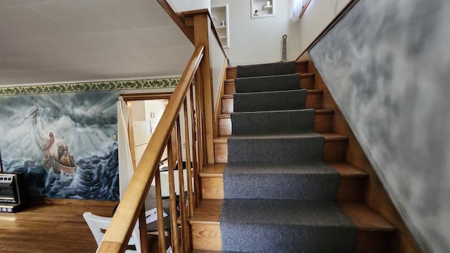 28 Eastland Ave, Millinocket, ME 04462 - stairs featuring wood finished floors and heating unit