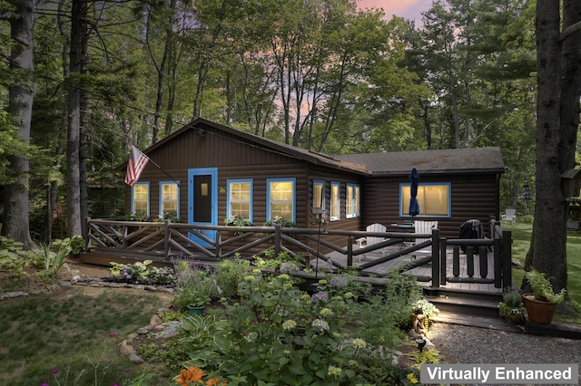 94 Crest Ave, Boothbay Harbor, ME 04538 - view of front of house featuring faux log siding, a deck, and roof with shingles
