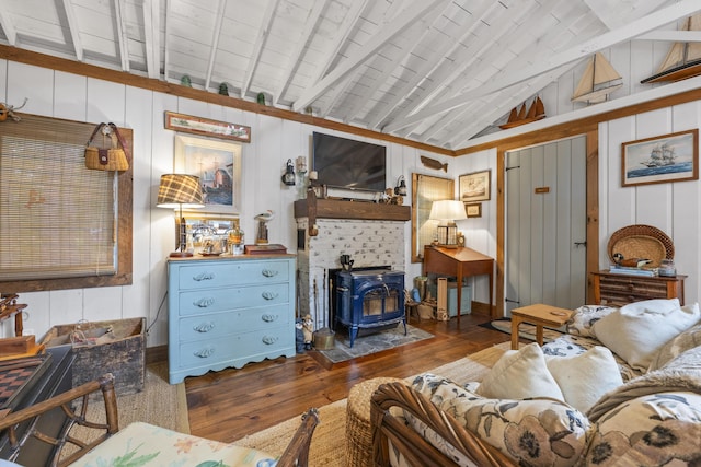 94 Crest Ave, Boothbay Harbor, ME 04538 - living area featuring hardwood / wood-style floors, a wood stove, and wooden walls