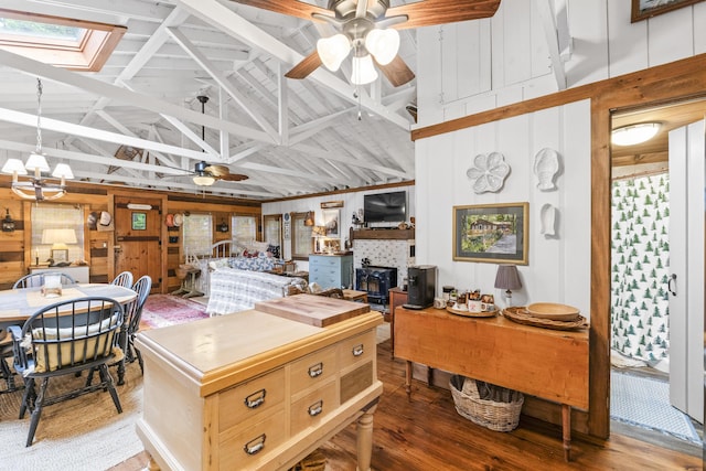 94 Crest Ave, Boothbay Harbor, ME 04538 - kitchen with high vaulted ceiling, a ceiling fan, wood finished floors, a skylight, and wooden walls
