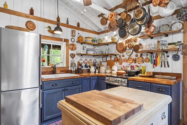 94 Crest Ave, Boothbay Harbor, ME 04538 - kitchen with stainless steel appliances, wooden counters, blue cabinets, and open shelves