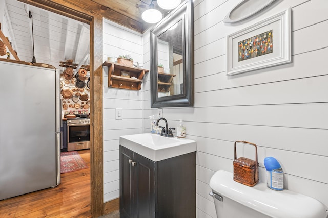 94 Crest Ave, Boothbay Harbor, ME 04538 - half bath featuring vanity and wood finished floors