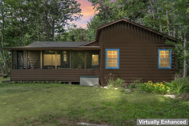 94 Crest Ave, Boothbay Harbor, ME 04538 - view of front of property featuring board and batten siding, a sunroom, log veneer siding, and a yard