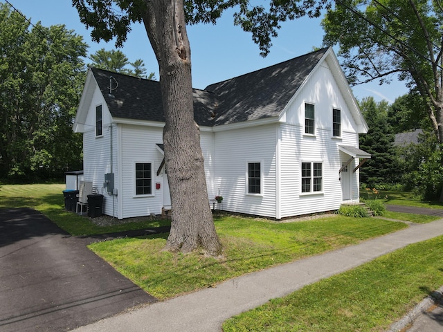42 Hillside Rd, Orono, ME 04473 - view of property exterior with a shingled roof and a yard