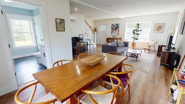 42 Hillside Rd, Orono, ME 04473 - dining room featuring an AC wall unit, stairs, plenty of natural light, recessed lighting, and light wood-type flooring
