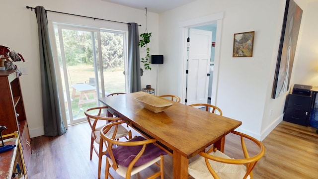 42 Hillside Rd, Orono, ME 04473 - dining area with light wood-style floors and baseboards