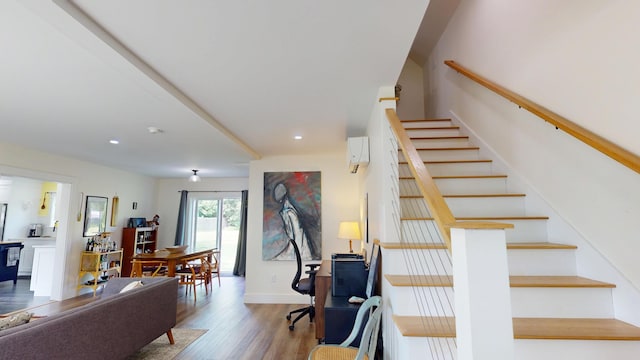 42 Hillside Rd, Orono, ME 04473 - staircase featuring wood finished floors, a wall unit AC, and recessed lighting