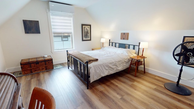 42 Hillside Rd, Orono, ME 04473 - bedroom with lofted ceiling and light wood finished floors