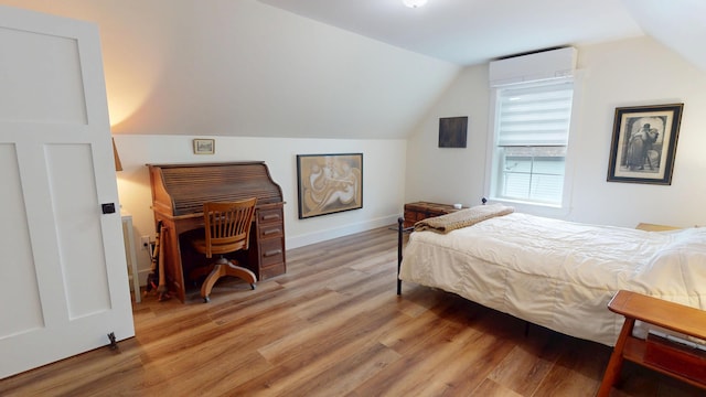 42 Hillside Rd, Orono, ME 04473 - bedroom with light wood-style flooring and vaulted ceiling
