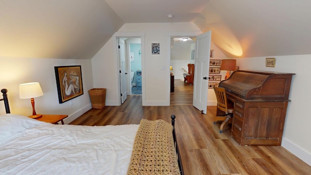 42 Hillside Rd, Orono, ME 04473 - bedroom with wood finished floors and vaulted ceiling