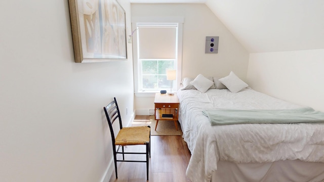 42 Hillside Rd, Orono, ME 04473 - bedroom featuring wood finished floors and vaulted ceiling
