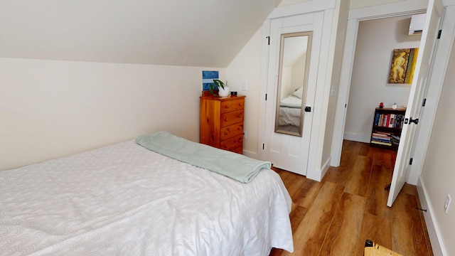 42 Hillside Rd, Orono, ME 04473 - bedroom with wood finished floors and vaulted ceiling