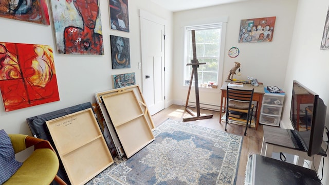 42 Hillside Rd, Orono, ME 04473 - office area featuring wood finished floors and a baseboard radiator