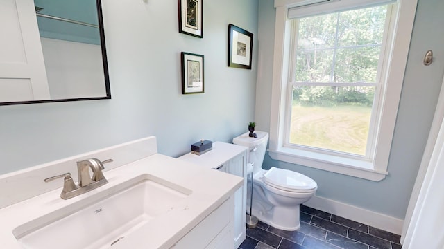 42 Hillside Rd, Orono, ME 04473 - bathroom featuring toilet and vanity