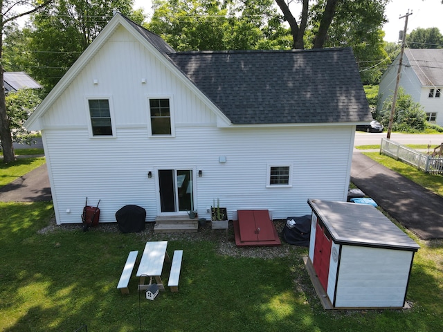 42 Hillside Rd, Orono, ME 04473 - rear view of property with board and batten siding, roof with shingles, a yard, and entry steps