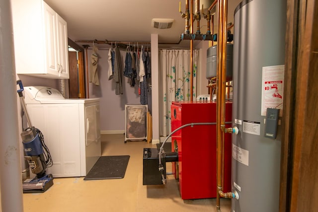 133 Ohio St, Millinocket, ME 04462 - laundry area featuring washing machine and clothes dryer, water heater, and cabinet space