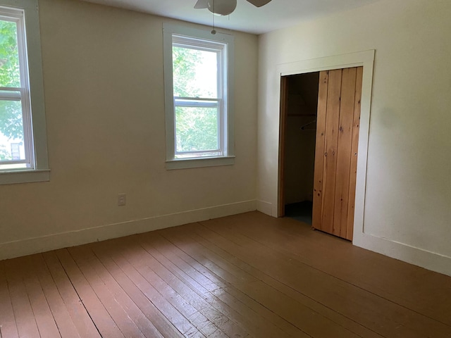 65 Quarry Rd, Sullivan, ME 04664 - unfurnished bedroom featuring hardwood / wood-style flooring, multiple windows, and a closet