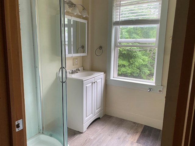 65 Quarry Rd, Sullivan, ME 04664 - full bath with vanity, a stall shower, and wood finished floors