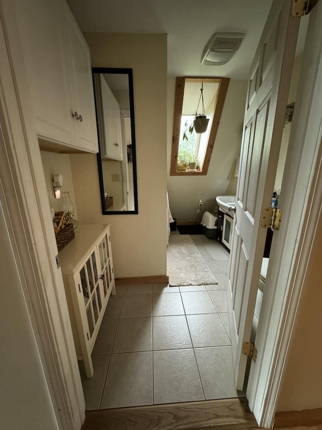 65 Quarry Rd, Sullivan, ME 04664 - bathroom featuring baseboards and tile patterned flooring