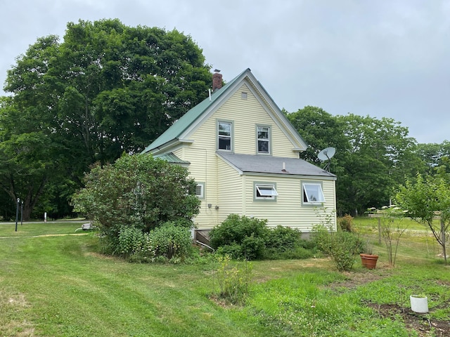 65 Quarry Rd, Sullivan, ME 04664 - view of property exterior with a chimney and a yard