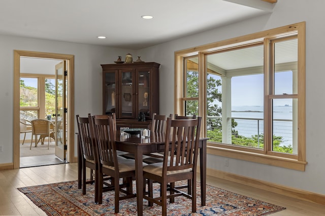 86 City Point Rd, Vinalhaven, ME 04863 - dining room featuring light wood finished floors, a water view, and recessed lighting